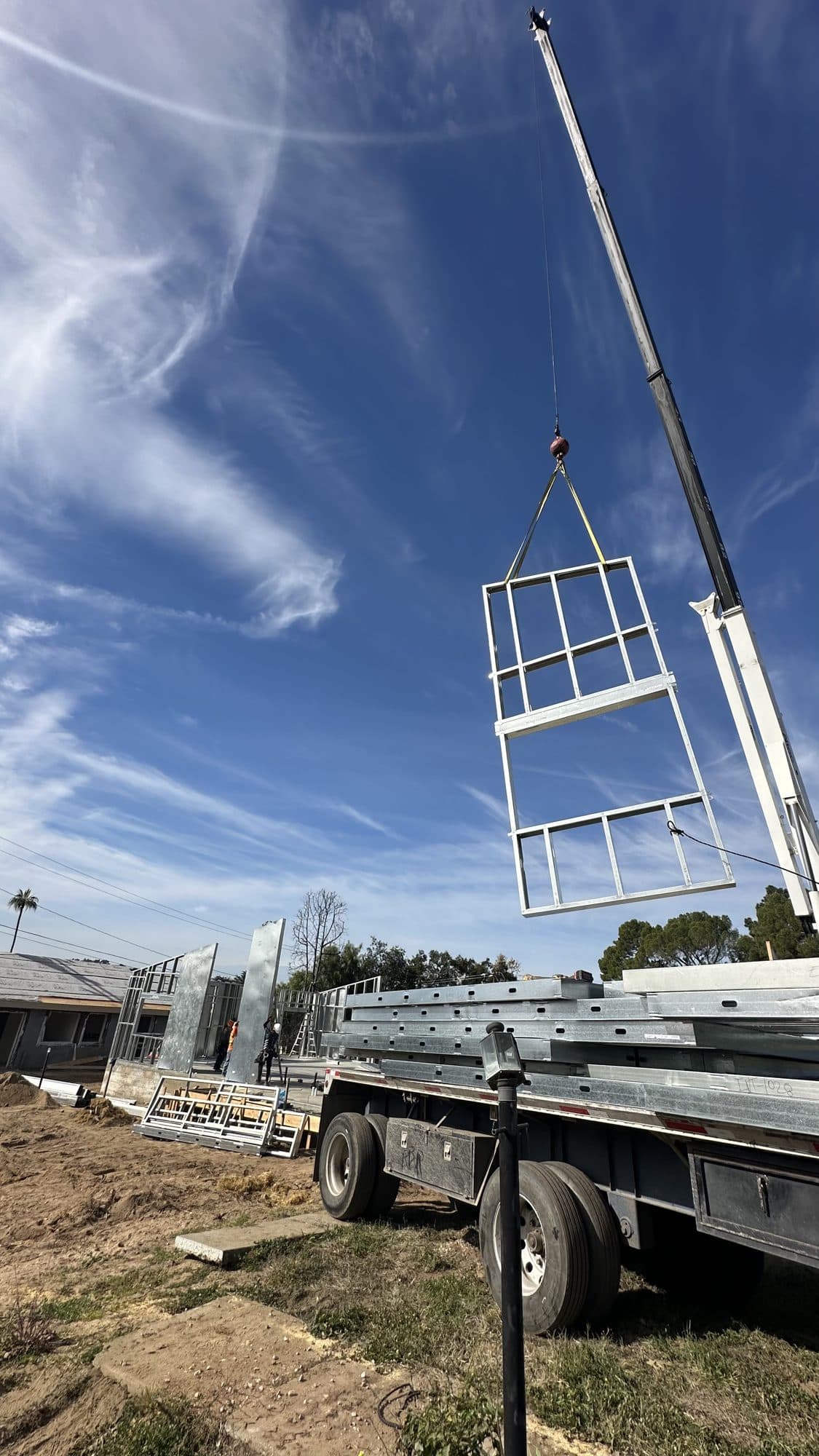 A wall panel craned into place